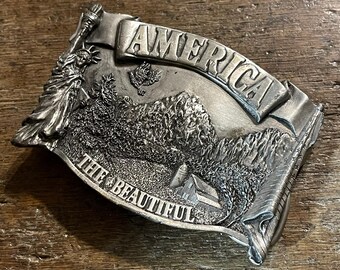 Vintage America The Beautiful wilderness mountain scene pewter colored belt buckle Bergamont 1983