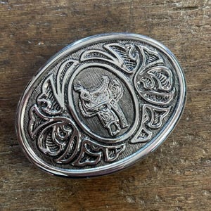 Vintage buckle Horse saddle and vines design  chrome colored belt buckle
