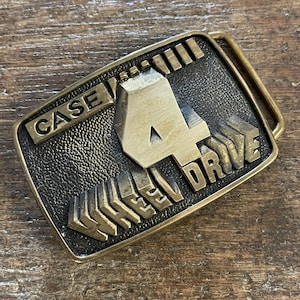 Vintage buckle Case 4 Wheel Drive advertising solid brass belt buckle