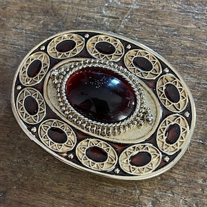 An Ornate Vintage Belt Featuring Intricate Designs and a Striking