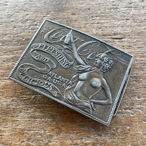 Vintage Coca Cola Refreshing and Delicious Sexy woman raised design design brass colored belt buckle