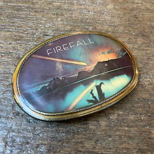 Vintage belt buckle Firefall Rock Music Group scene design brass colored base belt buckle Pacifica 1977
