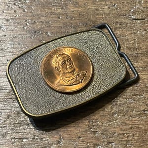 Vintage buckle John Wayne American Mounted Coin raised floral design copper colored western belt buckle