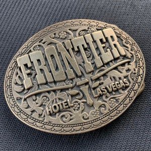 Vintage Frontier Hotel Las Vegas Nevada brass colored oval belt buckle