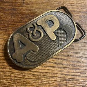 Vintage A & P supermarket grocery store advertising Brass colored belt buckle numbered