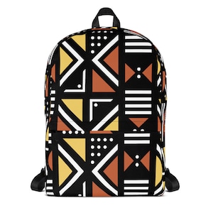 May include: Black backpack with a geometric pattern in yellow, orange, white, and black. The pattern is inspired by African art.