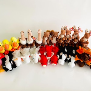 May include: A collection of plush animal toys, including ducks, ostriches, squirrels, kangaroos, cows, and a chicken. The toys are in various colors, such as yellow, brown, white, black, and red. The toys are arranged in rows.