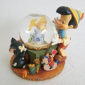 Pinocchio Snow Globe, Unique Music Box that plays &quot;Toyland&quot; by Victor Herber, antique disney memorabilia