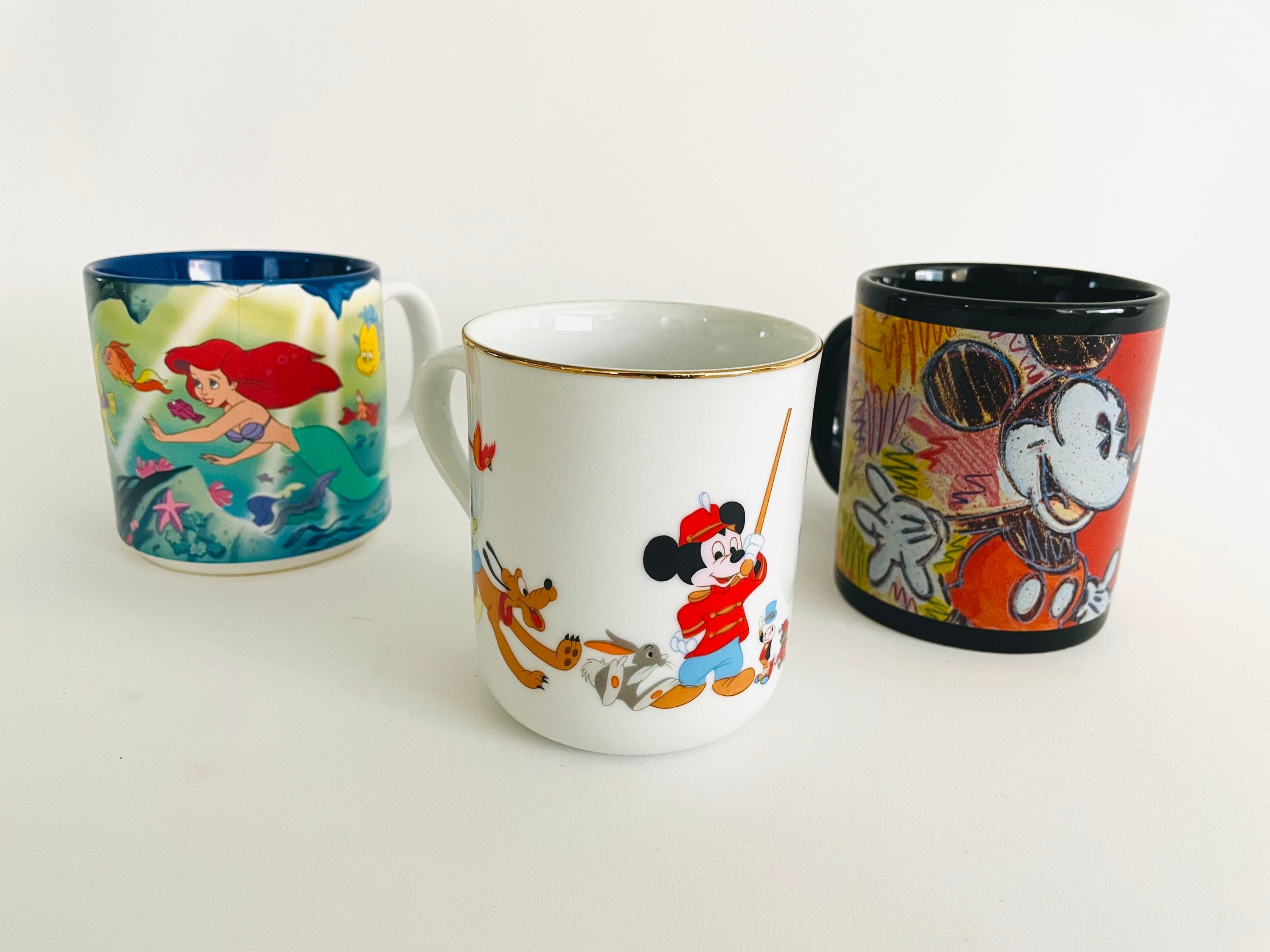 Three Disney Mugs, Ceramic Mug Mickey Mouse, the Little Mermaid, Pluto,  Pinocchio, Dumbo, Goofy, Donald, Red Mug, White Mug, Blue Mug, 