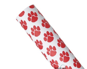 May include: White faux leather with a red paw print pattern. The fabric is textured and has a subtle sheen.