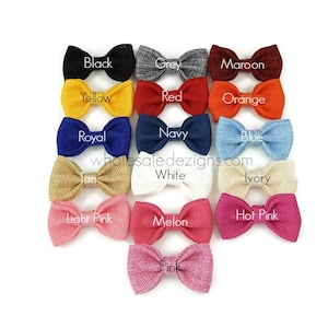 May include: A set of 15 burlap bows in various colors, including black, grey, maroon, yellow, red, orange, royal blue, navy blue, blue, tan, white, ivory, light pink, hot pink, and pink. The bows are arranged in rows, with the colors alternating.