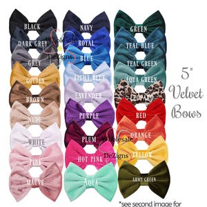 May include: A set of three ceramic mugs with a speckled, cream-colored glaze. Each mug features a different hand-painted floral design in shades of blue, green, and yellow. The mugs have a simple, rounded shape and a comfortable handle.