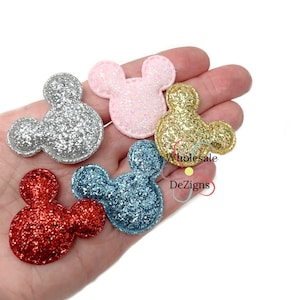 May include: A white ceramic mug with a black handle and the text "But First, Coffee" in a bold, black font. The mug is sitting on a wooden surface. The mug is approximately 4 inches tall.