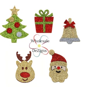 May include: Five Christmas-themed glitter craft shapes: a green Christmas tree, a red gift box with a green bow, a gold bell with a red bow, a gold reindeer with a red nose, and a gold Santa Claus with a red hat and nose.