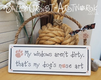 Funny sign for a dog owner, my windows aren't dirty...