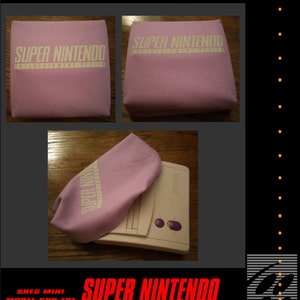 May include: A light purple SNES Mini console cover with the words "SUPER NINTENDO ENTERTAINMENT SYSTEM" in white. The cover is shown in multiple views, alongside the SNES Mini console.