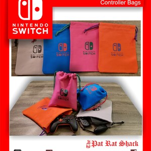 May include: A collection of colorful Nintendo Switch controller bags in various colors, including tan, blue, pink, and orange. Each bag features the Nintendo Switch logo and drawstring closure. The image also shows a black controller and other accessories.