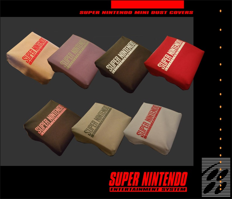 May include: A selection of Super Nintendo Mini dust covers in shades like beige, lilac, and red. Each cover displays the "SUPER NINTENDO" logo. The image also shows the "SUPER NINTENDO ENTERTAINMENT SYSTEM" logo. The covers are designed to protect the console.