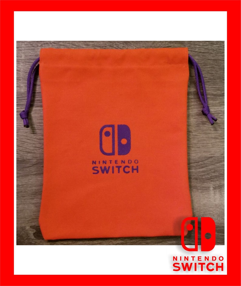 May include: An orange drawstring bag with a purple drawstring closure. The bag features the Nintendo Switch logo in purple and the words "NINTENDO SWITCH" in white. The bag is made of a soft material.