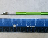 Exacto knife with 5 replacement blades
