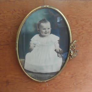 Antique Tinted Baby Photo Metal Decorative Oval Ornate Brass Frame Hand Tinted Colored White Dress Smiling Nursery Picture Wall Hanging image 1