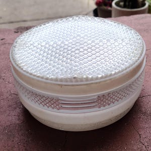 May include: A white and pink glass ceiling light fixture with a textured, bubbled glass top.