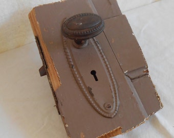 Antique Door Knob Hardware and Piece of Old Door