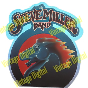 May include: A blue and white sticker with the text "The Steve Miller Band" in a stylized font. The sticker features a black and red illustration of a dragon's head with flames.