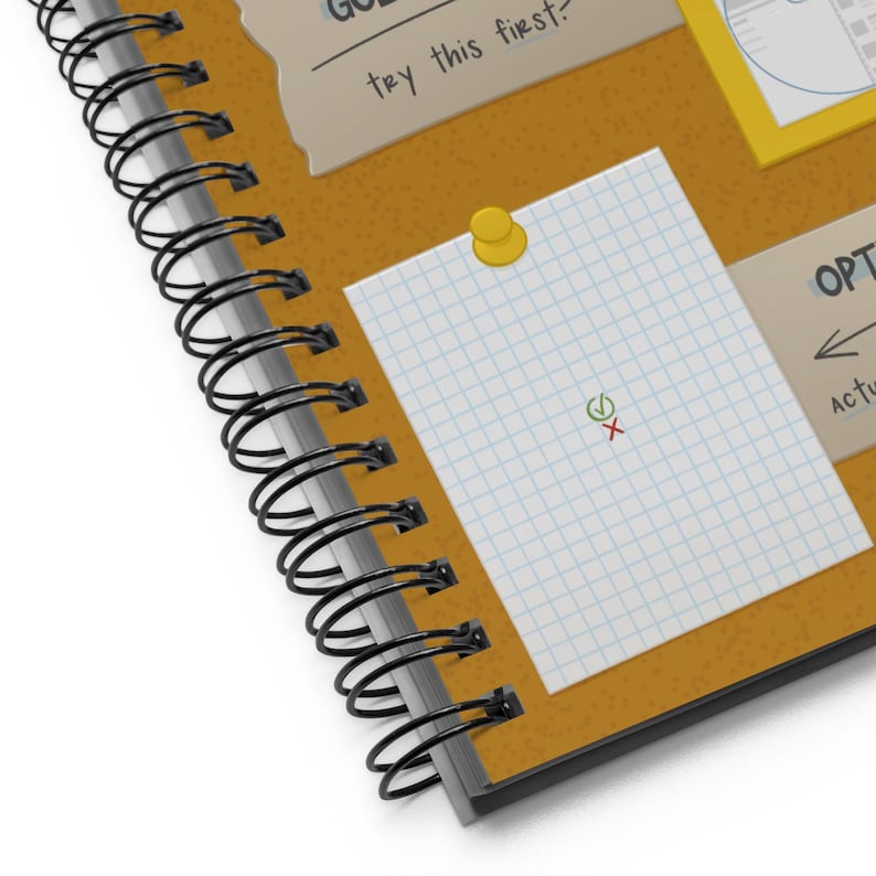 Detail shot of front cover of the Graphic Design Reference Notebook, showing illustration and background details.