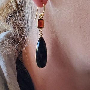 The Queen&#39;s Royal Guard: Iconic Black Onyx and Red Garnet Elongated Teardrop Earrings