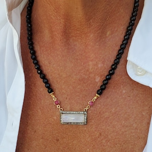 Necklace of Pave-set Rainbow Moonstone, White Topaz, Raw Rubies, Black Onyx and golden Vermeil