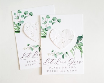May include: Two white cards with green watercolour foliage and a white heart-shaped seed paper. The text on the cards reads "Let Love Grow" and "Plant Me and Watch Me Grow!"