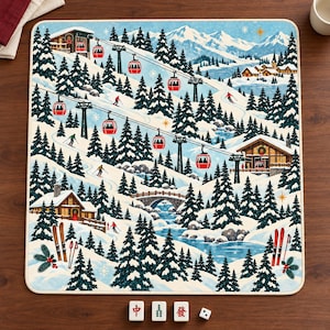 May include: A rectangular mat featuring a winter mountain landscape with pine trees, snow-covered cabins, a stone bridge, and red cable cars. Below the mat are three white tiles with red and green Chinese characters and one die.