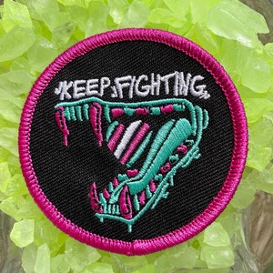 Keep Fighting trans pride patch