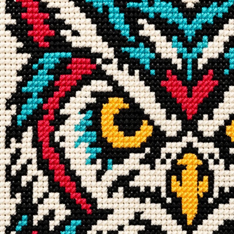 Macro of the stitched owl eyes and beak