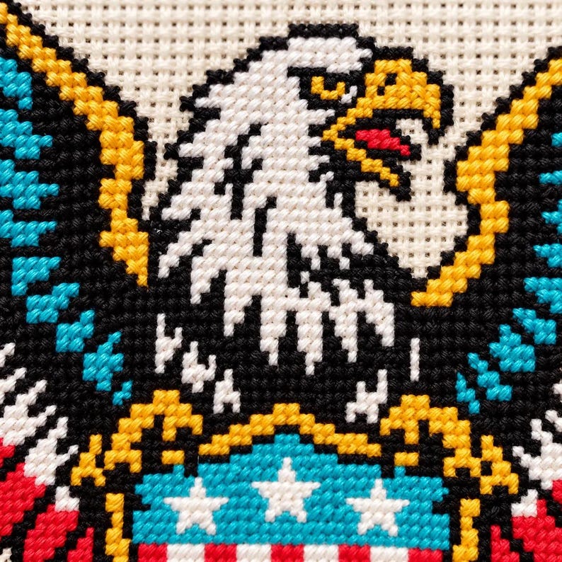 Macro of the stitched eagle head, beak and feathers