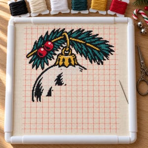 Skull ornament cross stitch in progress in a Q-snap frame