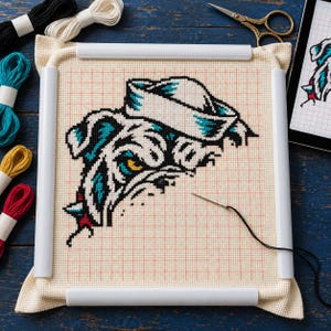 Bulldog cross stitch in progress in a Q-snap frame