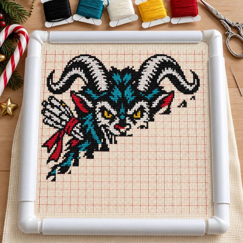 Krampus cross stitch in progress in a Q-snap frame