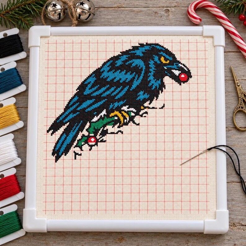 Raven wreath cross stitch in progress in a Q-snap frame
