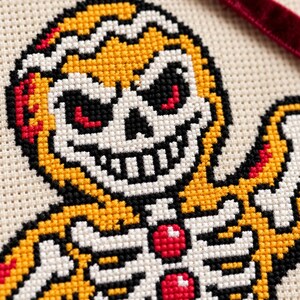 Macro of the stitched skull face and gumdrop buttons