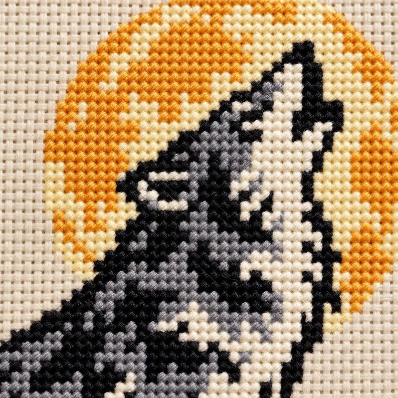 Macro of the stitched wolf head against the moon
