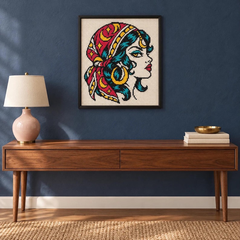 Framed fortune teller tattoo flash cross stitch on a wall