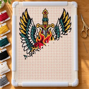 Sacred heart cross stitch in progress in a Q-snap frame