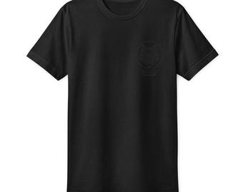 May include: A black short-sleeved t-shirt featuring a circular graphic on the left chest. The design consists of a geometric fox head outline enclosed in a circle with the text BORZ printed directly underneath the animal illustration.