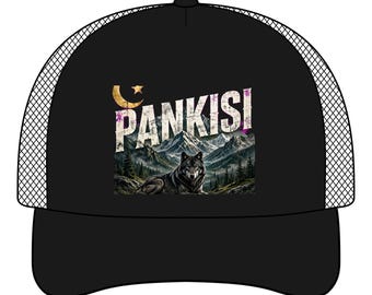 May include: A black trucker hat featuring a graphic print of a wolf resting in front of a mountain range. The text PANKISI is printed in white above the wolf, accompanied by a gold crescent moon and star symbol in the upper left corner.