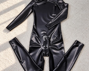 May include: A black long-sleeved bodysuit made of a shiny, smooth material. The garment features a high neckline and a central vertical zipper that extends from the mid-torso down to the crotch area, with full-length fitted legs.
