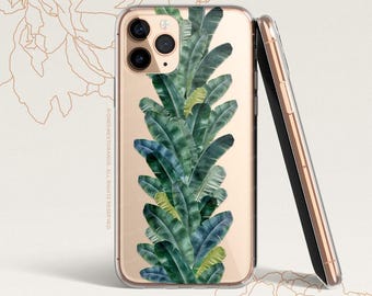 May include: A clear phone case with a gold trim and a design of green banana leaves. The case is shown on a white background.
