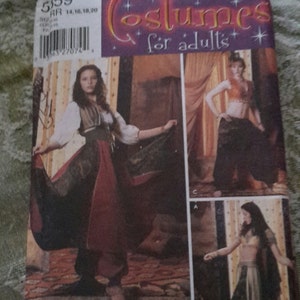 May include: A sewing pattern for adult costumes. The pattern includes three different costumes: a red and black skirt with a vest, a black skirt with a gold top, and a black skirt with a gold top and a black shawl. The pattern is from Simplicity and is for sizes 14, 16, 18, and 20.