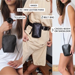 May include: A black leather purse with a zipper closure. The purse can be worn as a clutch, belt bag, or crossbody bag. The image shows three different ways to wear the purse.